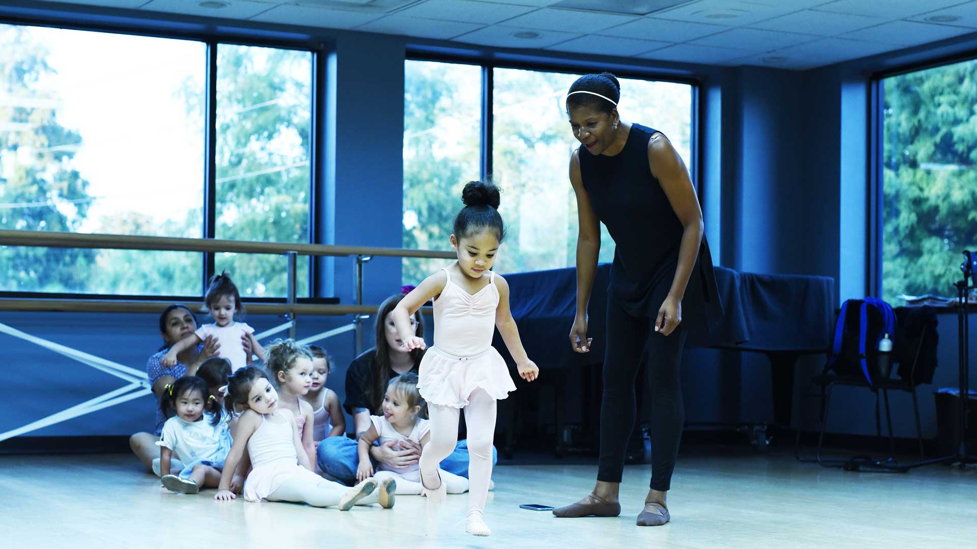 Kids learning to dance.